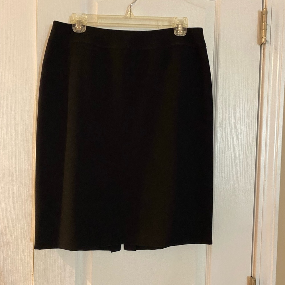 Black maxi skirt and white jacket with black trimmings